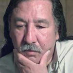 Leonard Peltier looks on during an interview