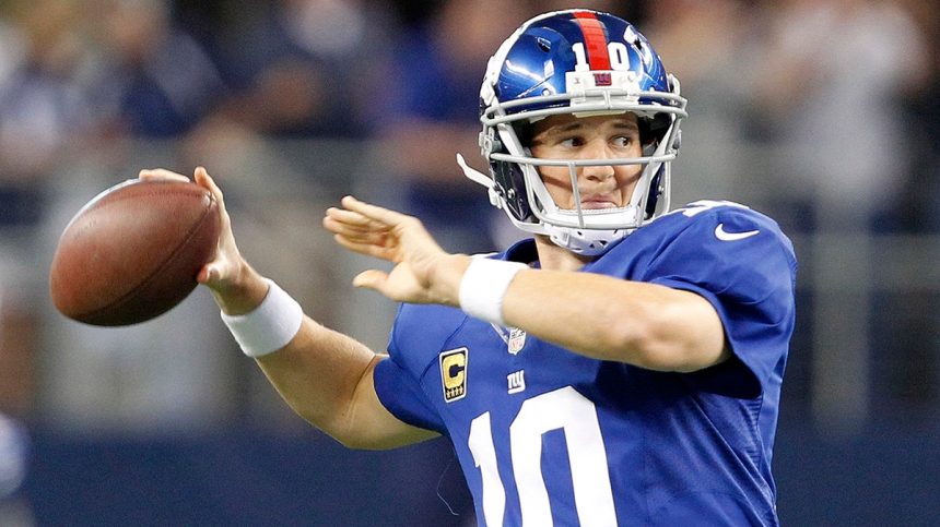 Giants quarterback Eli Manning warms up as the New York Giants face the Dallas Cowboys at AT&T Stadium in Arlington, Texas, on Sunday, September 8, 2013.