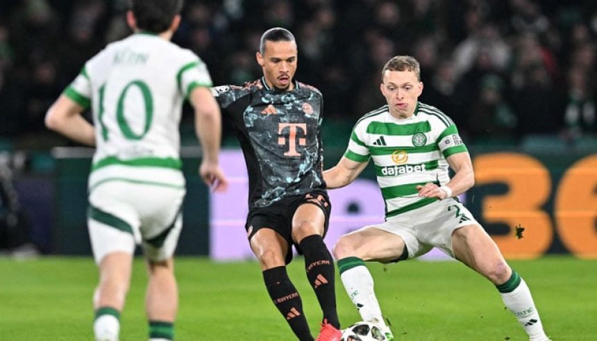 Celtics Canadian defender #02 Alistair Johnston (R) vies with Celtics German midfielder #10 Nicolas Kuhn during the UEFA Champions League play-off first leg football match between Celtic and Bayern Munich at Celtic Park stadium in Glasgow, Scotland on February 12, 2025. — AFP