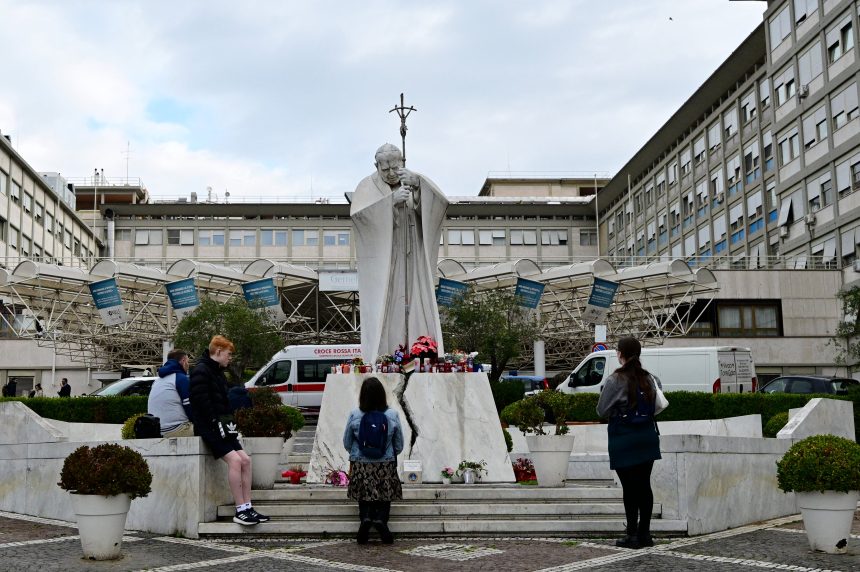 People outside the Gemelli hospital in Rome where the pontiff is being treated