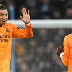 Real Madrid´s French forward #09 Kylian Mbappe celebrates with Real Madrid´s Brazilian forward #07 Vinicius Junior after scoring his team first goal during the UEFA Champions League football match between Manchester City and Real Madrid at the Etihad Stadium in Manchester, north west England, on February 11, 2025. — AFP