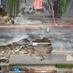 A drone view shows workers looking towards a large sinkhole in Godstone, southern Britain, February 19, 2025. — Reuters