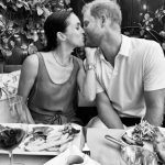 Meghan Markle and Prince Harry kissing at a meal