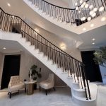 grand white entryway with staircase