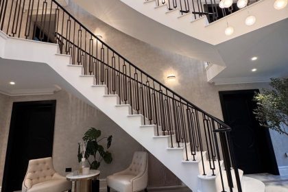 grand white entryway with staircase