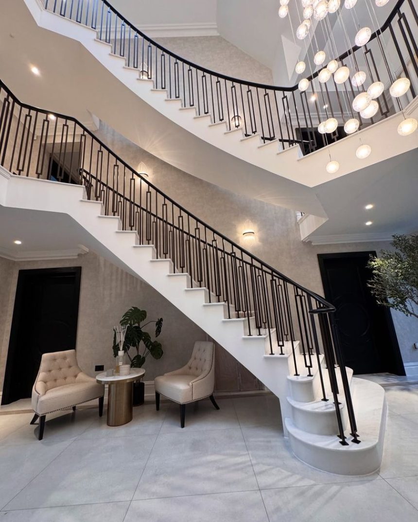 grand white entryway with staircase