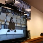 Spanish womens World Cup winner Jenni Hermoso is shown on the television testifying as journalists are pictured in the press room during the trial at the National Court, Madrid, Spain on February 3, 2025. — Reuters