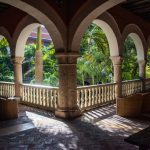 Angled view of the stone colonnade of a monastery cloister in Cartagena Colombia now the hotel Sofitel Legend Santa Clara.