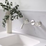 Brushed nickel tap on a white sink