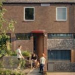 Red Steel and Brick Enliven a ’70s Rowhouse Renovation in London - Photo 1 of 15 -