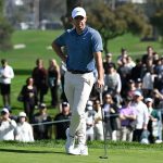 Rory McIlroy stands on green