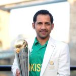 Former Pakistan captain Sarfaraz Ahmed poses with ICC Champions Trophy near the Tower Bridge in London, United Kingdom, on June 19, 2017. — ICC