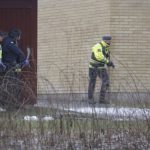 Police officers are seen at the Risbergska School in Orebro, Sweden