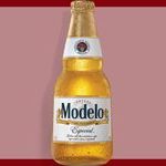 A bottle of Modelo beer on a bordered maroon background.