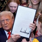 Donald Trump signs the executive order