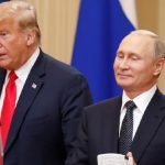 President Trump (L) speaks as Russias President Vladimir Putin stands beside him during a one-on-one meeting in Helsinki on July 16, 2018. — Reuters