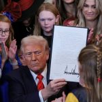 US President Donald Trump holds up a signed executive order banning transgender girls and women from participating in womens sports, in the East Room at the White House in Washington, US, February 5, 2025. — Reuters