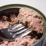 The tuna cans were recalle due to a manufacturing defect on the lids that poses a contamination risk