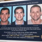 A display showing images of Alon, Oren, and Tal Alexander prior to a news conference in New York