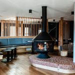 Inside a motor lodge with a wood burning stove