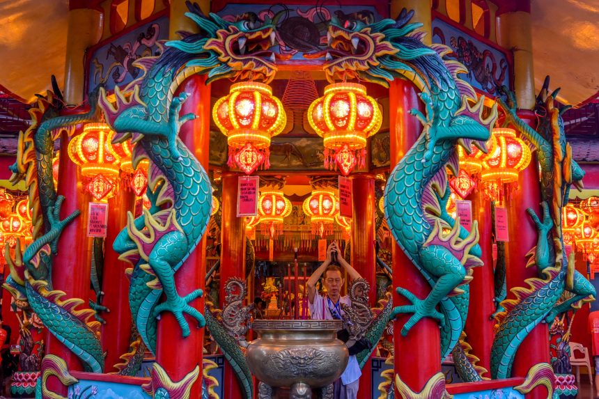 A man offers prayers on the eve of the Lunar New Year of the Snake in Jakarta