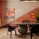 A dining room with a patterned table and bright walls